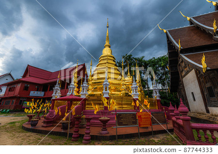 Beautiful Ancient golden color Pagoda in the Phan Tao temple is a Buddhist temple in the historic centre tourist attraction an ancient Thai art and is Public places in Chiang Mai,Thailand. Beautiful Ancient golden color Pagoda in the Phan Tao temple is a Buddhist temple in the historic centre tourist attraction an ancient Thai art and is Public places in Chiang Mai,Thailand. 87744333