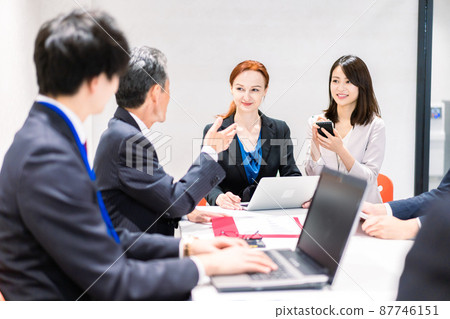 A woman interpreting at an international conference A woman interpreting at an international conference 87746151