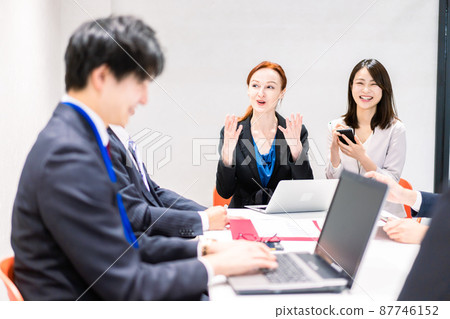 A woman interpreting at an international conference 87746152
