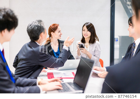 A woman interpreting at an international conference 87746154