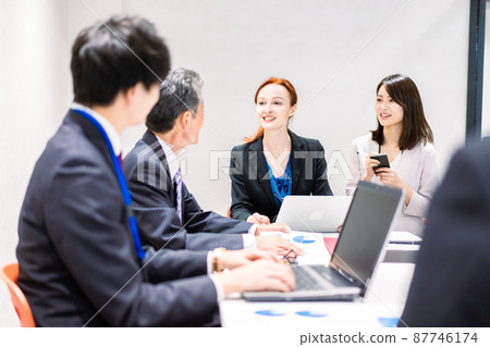 A woman interpreting at an international conference 87746174