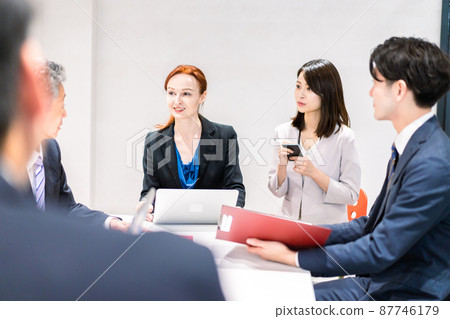 A woman interpreting at an international conference 87746179