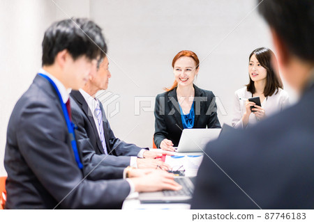 A woman interpreting at an international conference 87746183