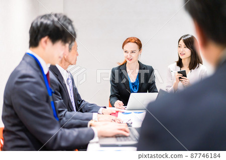 A woman interpreting at an international conference 87746184