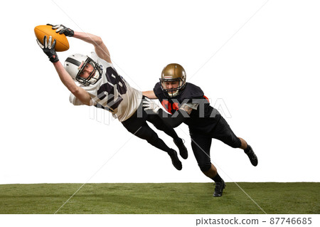 Two male american football players playing during sport match on grass flooring isolated on white background. Concept of sport, challenges, goals, strength. Poster, banner for ad 87746685