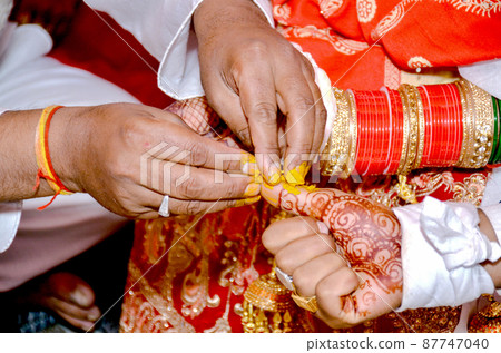 Haldi Wedding ritual the beginning of sacred Indian wedding ritual 87747040