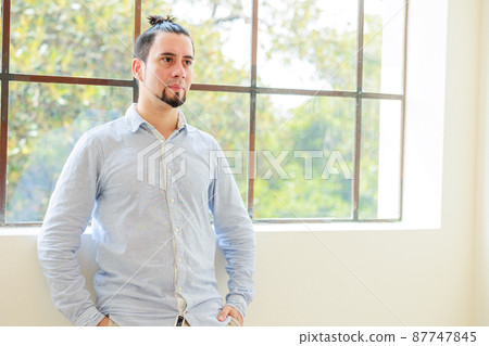 Chileans standing in front of the window 87747845