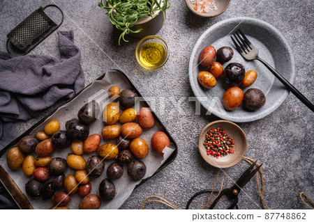 Baked new colorful potatoes 87748862