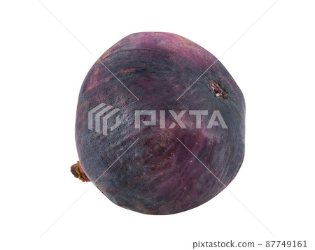 Purple fig isolated on white with copy space for text or images. Soft, sweet fruit, skin is very thin, has many small seeds inside of it. Close-up. Purple fig isolated on white with copy space for text or images. Soft, sweet fruit, skin is very thin, has many small seeds inside of it. Close-up. 87749161