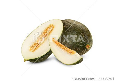 Delicious green tendral melon in cross-section, isolated on white background with copy space for text or images. Side view. Close-up shot. Delicious green tendral melon in cross-section, isolated on white background with copy space for text or images. Side view. Close-up shot. 87749201