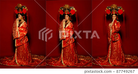 Asian Woman wear China Royal empress traditional costume with golden line design dress and headwear Asian Woman wear China Royal empress traditional costume with golden line design dress and headwear 87749267