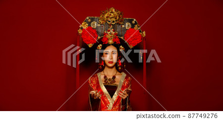 Asian Woman wear China Royal empress traditional costume with golden line design dress and headwear Asian Woman wear China Royal empress traditional costume with golden line design dress and headwear 87749276