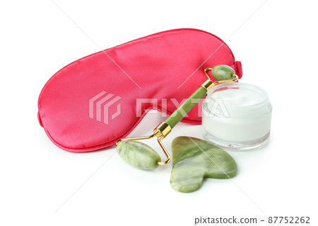 Face care accessories with face roller isolated on white background 87752262
