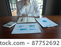 Businessmen are pointing numbers, graph, chart in business results. Business concept. 87752692