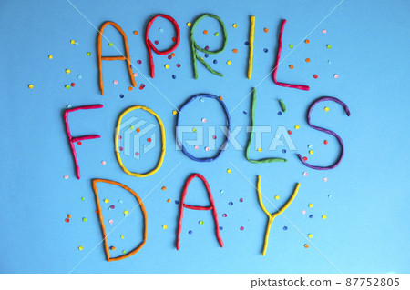 Funny font first april fools day written in plastecine of different colors. 87752805