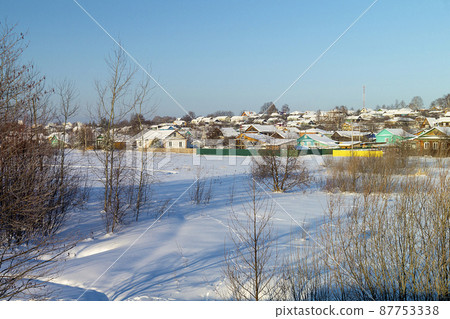 Winter landscape with village on background blue sky 87753338