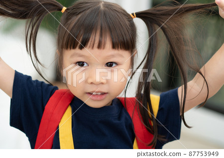 Portrait of happy and funny Asian child girl on white background, a child looking at camera. Preschool kid dreaming fill with energy feeling healthy and good concept Portrait of happy and funny Asian child girl on white background, a child looking at camera. Preschool kid dreaming fill with energy feeling healthy and good concept 87753949