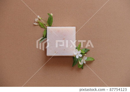 Flat lay of a handmade organic vegan soap showing the concept of sustainable comfort and Springtime Flat lay of a handmade organic vegan soap showing the concept of sustainable comfort and Springtime 87754123