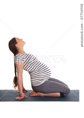 Pregnant woman doing yoga asana Ustrasana Pregnant woman doing yoga asana Ustrasana 87754508