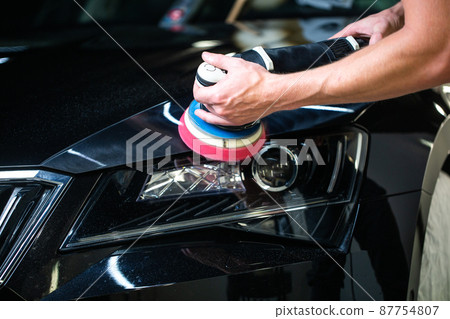 Close up of car detailist hands, cleaning or pilishing the car by poliermaschine, car detailing concept, orbital polisher in repair shop polishing car Close up of car detailist hands, cleaning or pilishing the car by poliermaschine, car detailing concept, orbital polisher in repair shop polishing car 87754807