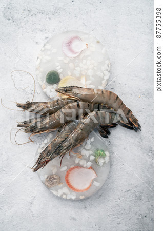 Raw shrimps on decorated ice Raw shrimps on decorated ice 87755398