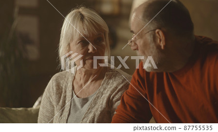 Senior couple having argument on sofa 87755535