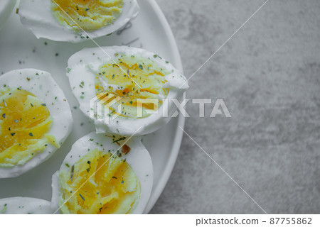 halves of a boiled eggs on a plate with space for text halves of a boiled eggs on a plate with space for text 87755862