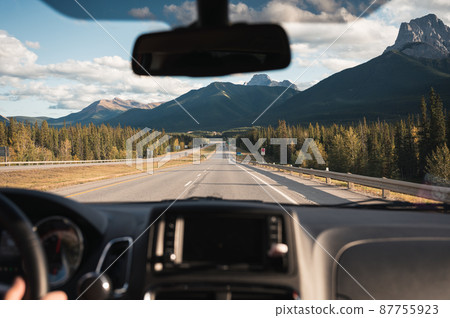 Road trip with car driving with rocky mountains on highway in Banff national park Road trip with car driving with rocky mountains on highway in Banff national park 87755923