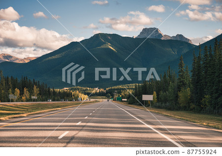 Road trip with car driving with rocky mountains on highway in Banff national park 87755924