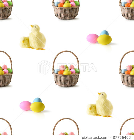 Easter wicker basket with pastel colorful eggs isolated on white. 87756403