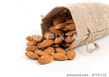 Almonds on a white background Almonds on a white background 87757135
