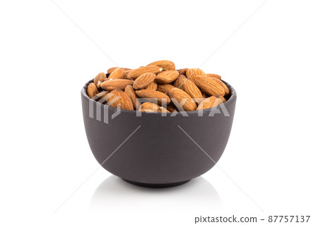 Almonds on a white background Almonds on a white background 87757137