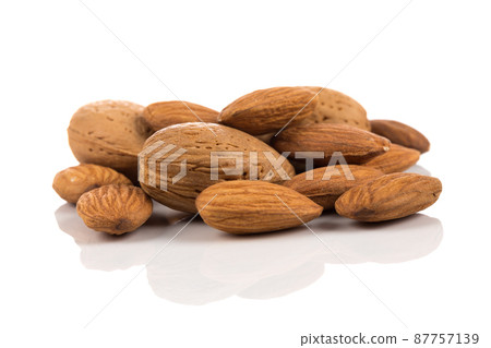 Almonds on a white background Almonds on a white background 87757139