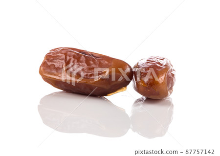 Date fruit close up isolated on white background Date fruit close up isolated on white background 87757142