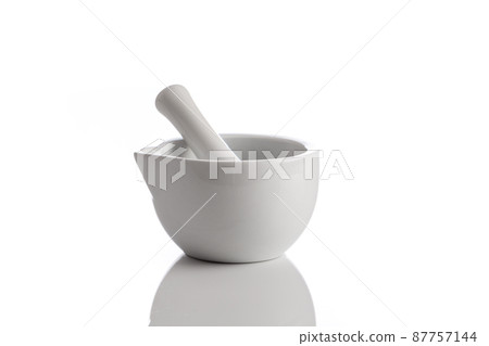 mortar and pestle isolated on white background mortar and pestle isolated on white background 87757144