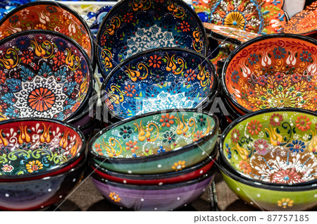 Painted decorative plates and lacquered dishes at the market. Painted decorative plates and lacquered dishes at the market. 87757185