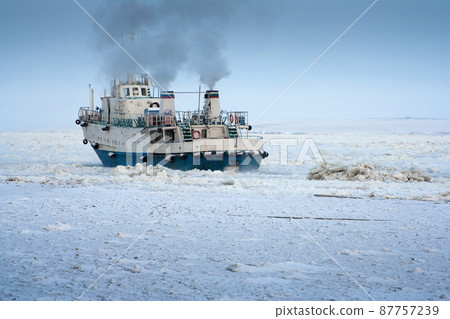 A passenger ship sails among the ice in the Arctic 87757239