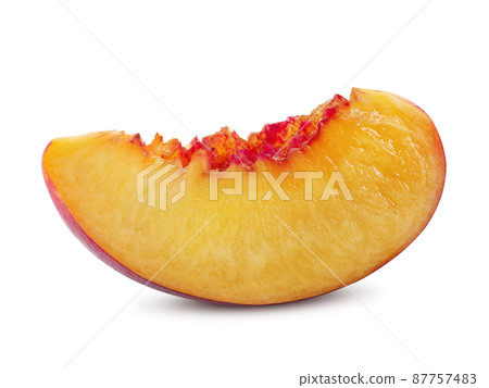 Unpitted, smooth-skinned nectarine fruit slice isolated on white background with copy space for text or images. Close-up shot. Unpitted, smooth-skinned nectarine fruit slice isolated on white background with copy space for text or images. Close-up shot. 87757483