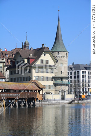 Part of the famous Chapel Bridge Lucerne and old round tower. Part of the famous Chapel Bridge Lucerne and old round tower. 87758015