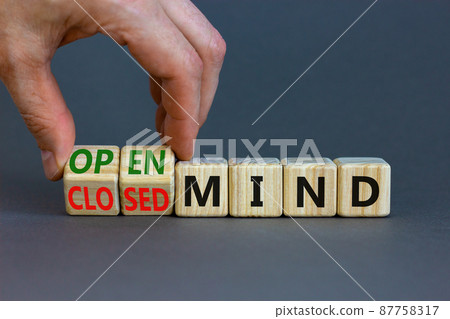 Open or closed mind symbol. Businessman turns cubes and changes concept words closrd mind to open mind. Beautiful grey table, grey background, copy space. Business open or closed mind concept. Open or closed mind symbol. Businessman turns cubes and changes concept words closrd mind to open mind. Beautiful grey table, grey background, copy space. Business open or closed mind concept. 87758317