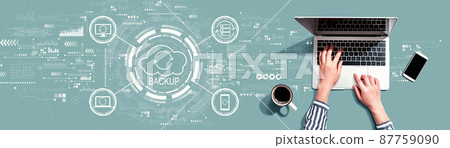 Backup concept with person using laptop Backup concept with person using laptop 87759090