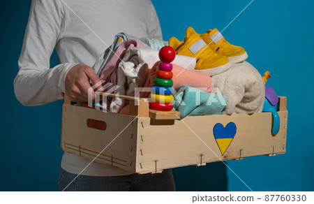 Donation box with children's things and toys for Ukrainian refugees. Donation box with children's things and toys for Ukrainian refugees. 87760330