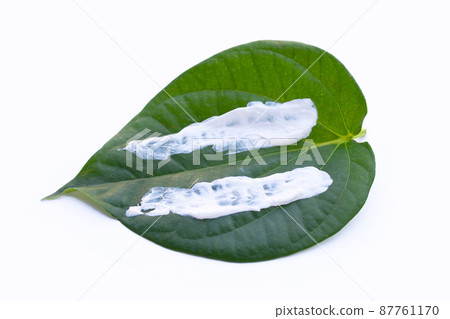 Chewing betel nut, Cal lime powder on betel leaves 87761170