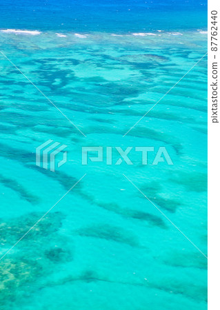 Tropical caribbean ocean water of bright teal and crystal clear Tropical caribbean ocean water of bright teal and crystal clear 87762440
