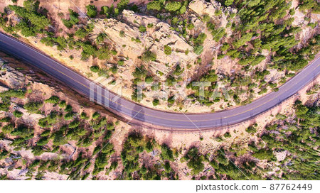 Aerial road through desert landscape looking down Aerial road through desert landscape looking down 87762449