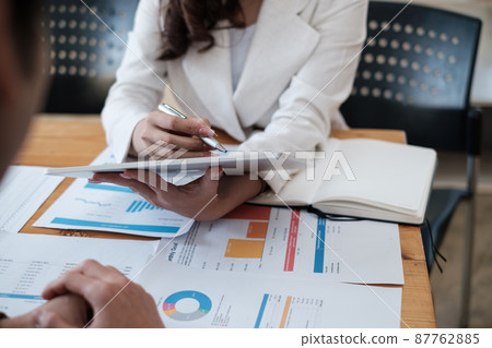 Group of IT consultant working by digital tablet and management big data and analyze financial document of company. Group of IT consultant working by digital tablet and management big data and analyze financial document of company. 87762885