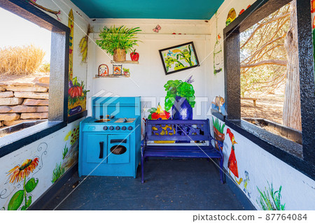 Sunny view of a wooden house in The Botanic Garden of Oklahoma State University 87764084