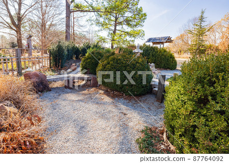 Sunny view of Japanese garden of The Botanic Garden of Oklahoma State University 87764092