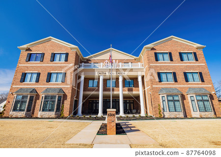 Sunny exteior view of the campus of Oklahoma State University 87764098