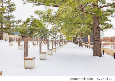 Overcast view of a snowy garden of Oklahoma City National Memorial and Museum Overcast view of a snowy garden of Oklahoma City National Memorial and Museum 87764149